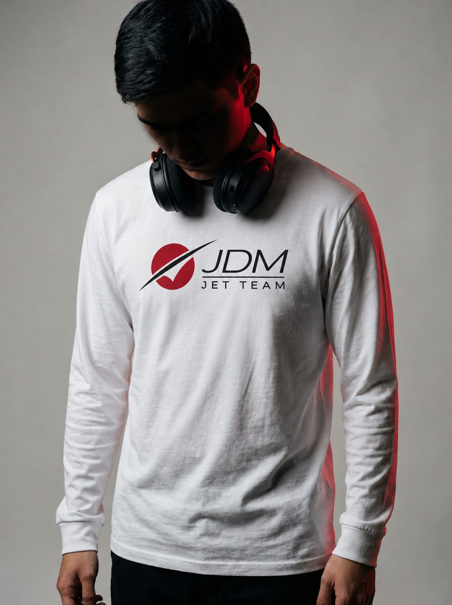 A JDM Jet Team gamer in a white jersey with a headset around the neck, face in shadow